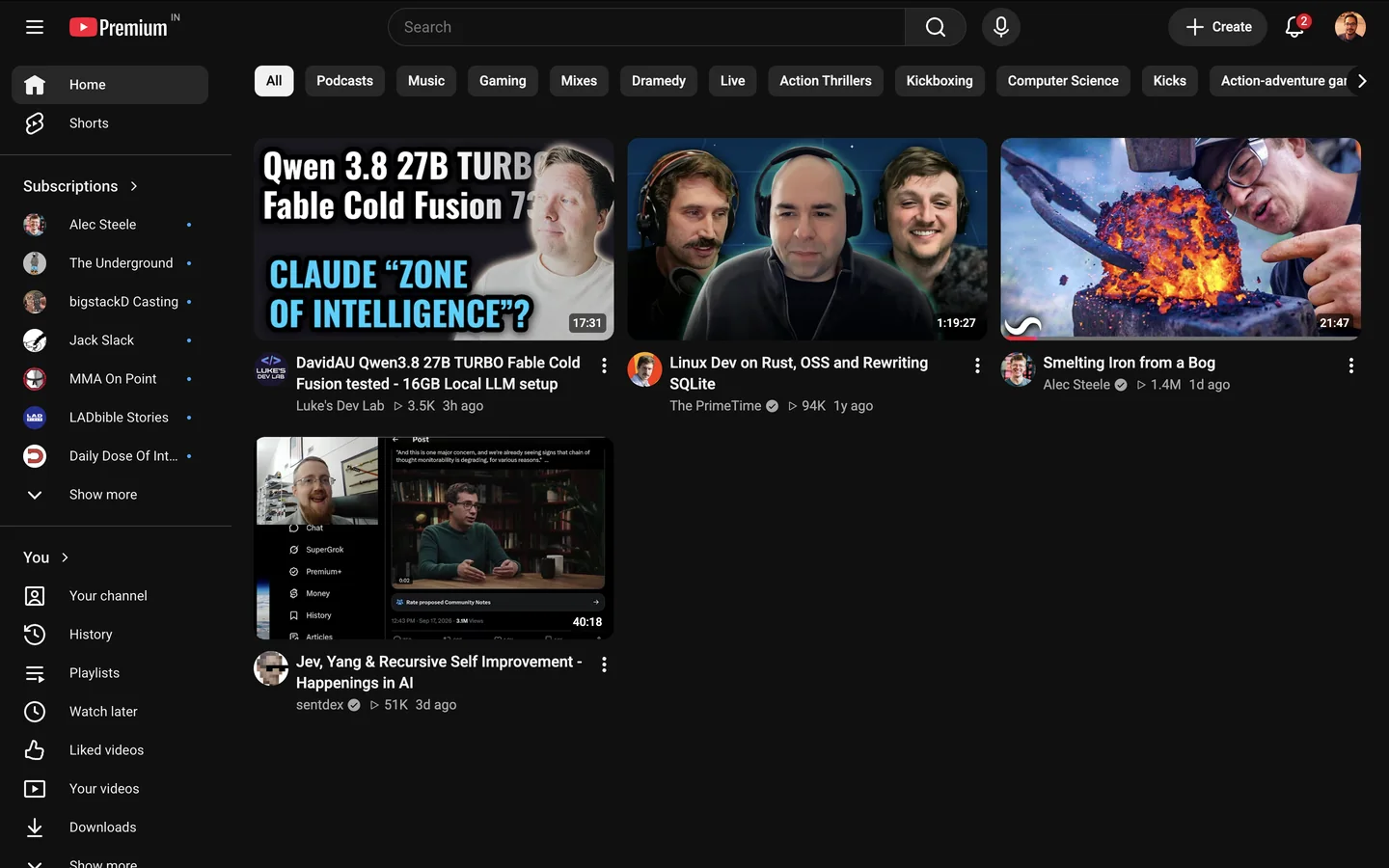 The filtered YouTube feed showing educational videos about AI, programming, and metalworking